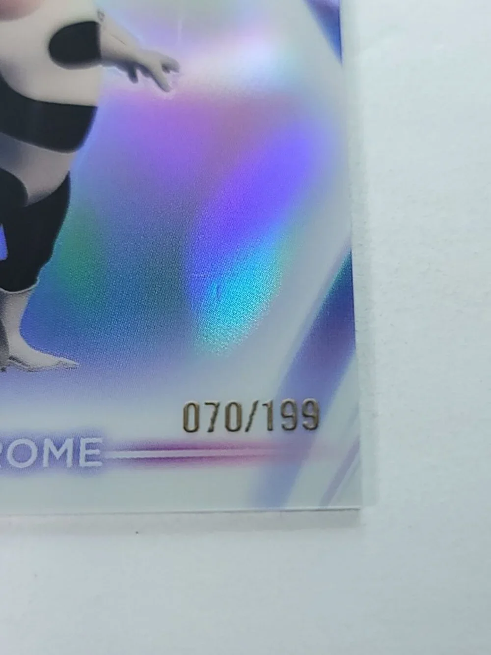 Syndrome Topps 2026 Disney Neon Holo Chrome Limited 070/199 CNE Mark Near Hand
